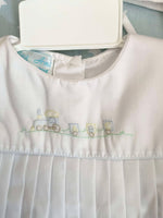 Petit Ami romper with train embroidery with cap. Newborn